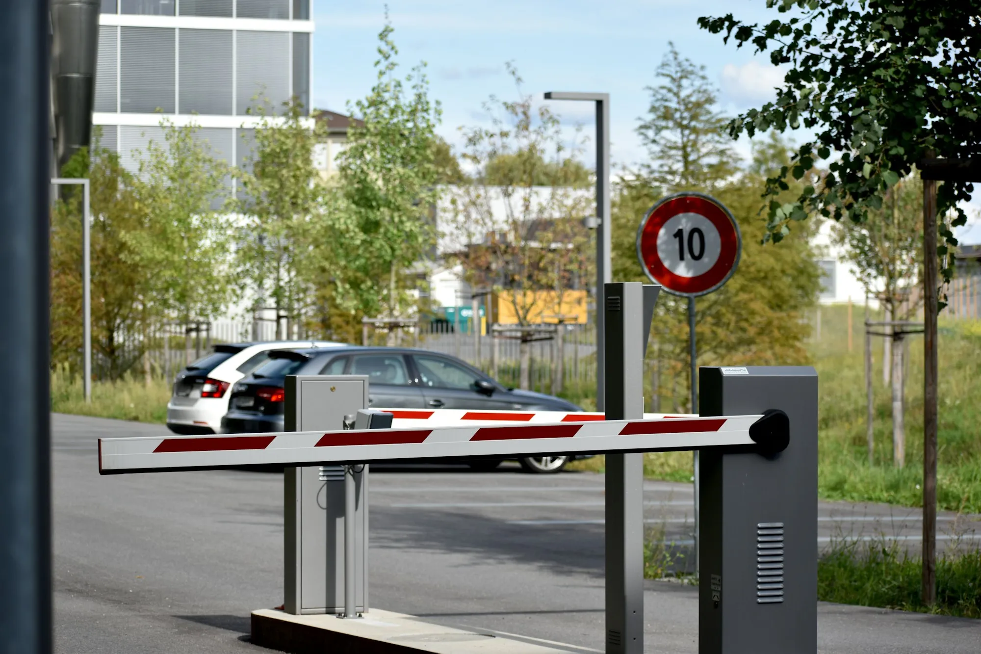 Parking boom barrier across a car park lane